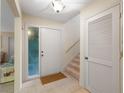 Inviting entryway with tile flooring, a side-lite, and a staircase leading upstairs at 3401 Avenida Madera # B, Bradenton, FL 34210