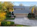 Charming home with well-maintained landscaping, mature trees, and a spacious driveway at 3401 Avenida Madera # B, Bradenton, FL 34210