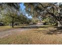 House nestled on a spacious lot with lush green surroundings at 4609 Horton Rd, Plant City, FL 33567