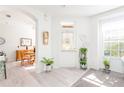 Welcoming entryway with light flooring and access to living and dining areas at 5733 Heronpark Pl, Lithia, FL 33547