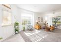 Bright and airy living room with comfy seating and plenty of natural light at 5733 Heronpark Pl, Lithia, FL 33547