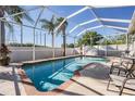 Inviting screened-in pool area with brick decking and comfortable seating at 7817 Water Tower Dr, Tampa, FL 33619