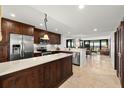 Modern kitchen with stainless steel appliances and island at 9415 Blind Pass Rd # 601, St Pete Beach, FL 33706