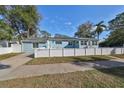 Newly renovated light blue house with white fence at 1846 3Rd S St, St Petersburg, FL 33705