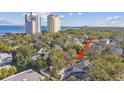 Aerial view showing home's location near water and high-rises at 2925 W Tambay Ave, Tampa, FL 33611