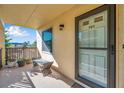 Condo entry with a bench and door leading inside at 460 Paula S Dr # 101, Dunedin, FL 34698