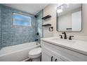 Updated bathroom with subway tile, a new vanity, and modern fixtures at 5426 Kimberly Ln, Holiday, FL 34690