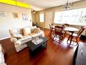 Living room and dining area with hardwood floors and a couch at 1235 S Highland Ave # 2-308, Clearwater, FL 33756