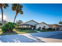 Home's exterior showcasing landscaping and driveway at 2268 Lake Arbor Blvd, Clearwater, FL 33763