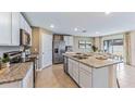 Modern kitchen featuring granite countertops and stainless steel appliances at 3317 Ivy Hollow Dr, Plant City, FL 33565