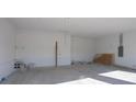 Unfinished two-car garage with concrete floor and ample space at 3430 Sarto Ln, Rotonda West, FL 33947