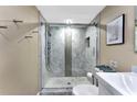 Updated bathroom with a large walk-in shower and modern fixtures at 900 Cove Cay Dr # 2B, Clearwater, FL 33760