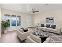 Bright living room with large windows and stylish furniture at 9201 40Th N Way, Pinellas Park, FL 33782