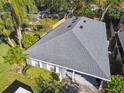 Single-story house with gray roof, and backyard at 116 S Hale Ave, Tampa, FL 33609