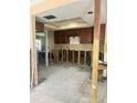 Spacious kitchen featuring custom cabinetry awaiting renovation and design to make it a culinary dream at 116 S Hale Ave, Tampa, FL 33609