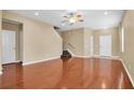 Bright living room with hardwood floors and access to kitchen at 17530 Stinchar Dr, Land O Lakes, FL 34638