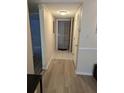A clean entryway showcasing tile and wood floors and featuring a security screen door at 4500 37Th S St # 27, St Petersburg, FL 33711