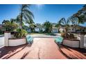 Residential area with benches and palm trees at 812 Franklin Cir, Palm Harbor, FL 34683