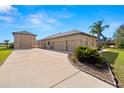 Spacious three-car garage with additional storage space at 15435 27Th E Ct, Parrish, FL 34219