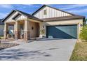 One-story house with a green garage door and well-maintained landscaping at 21489 Billowy Jaunt Dr, Land O Lakes, FL 34637