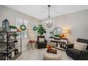 Cozy sitting area featuring comfortable armchairs and decorative accents at 11321 Chilly Water Ct, Riverview, FL 33569