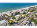 Beachfront property aerial view showcasing building and ocean proximity at 1510 Gulf Blvd # 105, Indian Rocks Beach, FL 33785