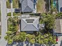 Overhead view of house featuring solar panels and tile roof at 35 Juniper Way, Clearwater Beach, FL 33767
