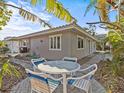 Charming patio with table and chairs, perfect for outdoor dining at 35 Juniper Way, Clearwater Beach, FL 33767