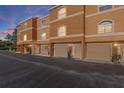 A lovely exterior shot of townhomes showcasing attached garages and well maintained landscaping at 637 Pinellas Bayway S # 207, Tierra Verde, FL 33715