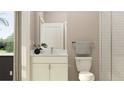 Small bathroom with white vanity, toilet, and shower at 18194 Serene Lake Loop, Lutz, FL 33548