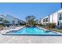 Inviting community pool with ample deck space for lounging at 2060 Marilyn St # 241, Clearwater, FL 33765