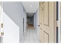 View down condo entry hallway, light-colored tile floors at 3034 Eastland Blvd # D108, Clearwater, FL 33761