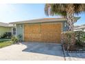 Attached garage with damaged door requiring repair or replacement at 3954 Marine Pkwy, New Port Richey, FL 34652