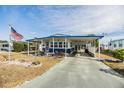 Mobile home exterior features carport and well-maintained landscaping at 5312 Mary St, Zephyrhills, FL 33542
