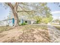 Side view of light blue house with spacious yard at 920 16Th Sw Ave, Largo, FL 33770