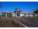 Modern clubhouse with metal roof and landscaping at 17778 Solstice Ave, Venice, FL 34293