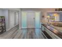 Bright entryway with white door and hardwood floors at 3201 61St N St, St Petersburg, FL 33710