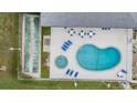Overhead view of a community pool, hot tub, and shuffleboard at 10800 Us 19 N. # 230, Pinellas Park, FL 33782