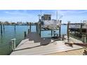 Private boat lift on spacious dock with water access at 353 144Th Ave, Madeira Beach, FL 33708