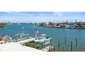 Scenic waterfront view with private boat dock at 353 144Th Ave, Madeira Beach, FL 33708