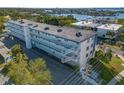 Aerial view showcasing the condo building's location and waterfront access at 55 Harbor View Ln # 301, Belleair Bluffs, FL 33770