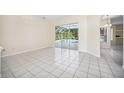 Bright dining room with tile floors and view of the pool at 9336 Tooke Shore Dr, Weeki Wachee, FL 34613