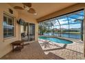 Relaxing screened pool area with water view at 18014 Cozumel Isle Dr, Tampa, FL 33647