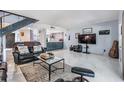 Open concept living room with access to kitchen and patio at 215 Woods Landing Trl, Oldsmar, FL 34677