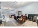 Bright dining area with table and chairs, view into living room at 6710 121St Ave # 1, Largo, FL 33773