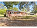 Brick ranch home with large yard and mature trees at 7846 Forbes Rd, Zephyrhills, FL 33540