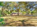 Brick ranch home situated on a large lot with mature trees at 7846 Forbes Rd, Zephyrhills, FL 33540