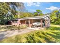 Brick ranch home with covered carport and boat storage at 7846 Forbes Rd, Zephyrhills, FL 33540