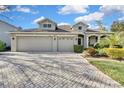 Attractive two-story home with a three-car garage at 9739 Asbel Estates St, Land O Lakes, FL 34638