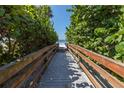 Wooden boardwalk leads to sandy beach at 16104 1St E St, Redington Beach, FL 33708